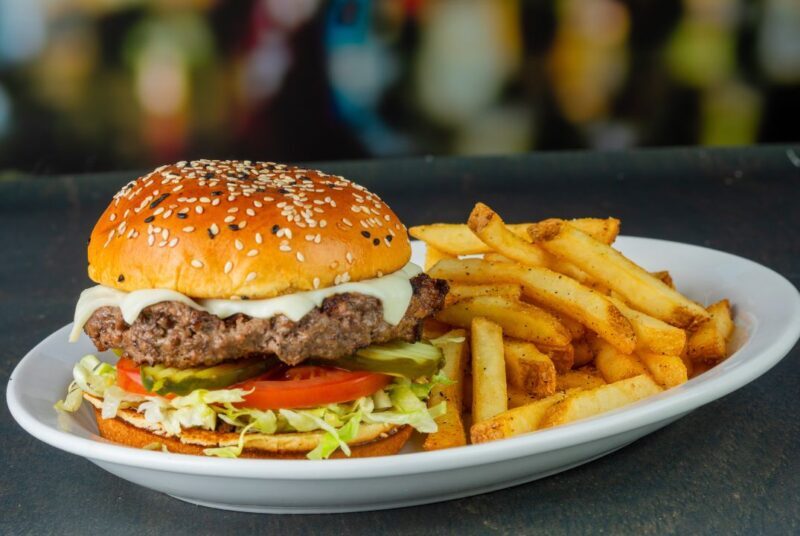 a classic cheeseburger with shredded lettuce and a blend of cheeses